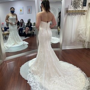 Wedding dress with nude/blush undertones and white lace